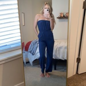 Blue strapless jumpsuit with pockets